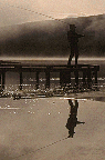 PICTURE OF A MAN FISHING 
IN THE FOG